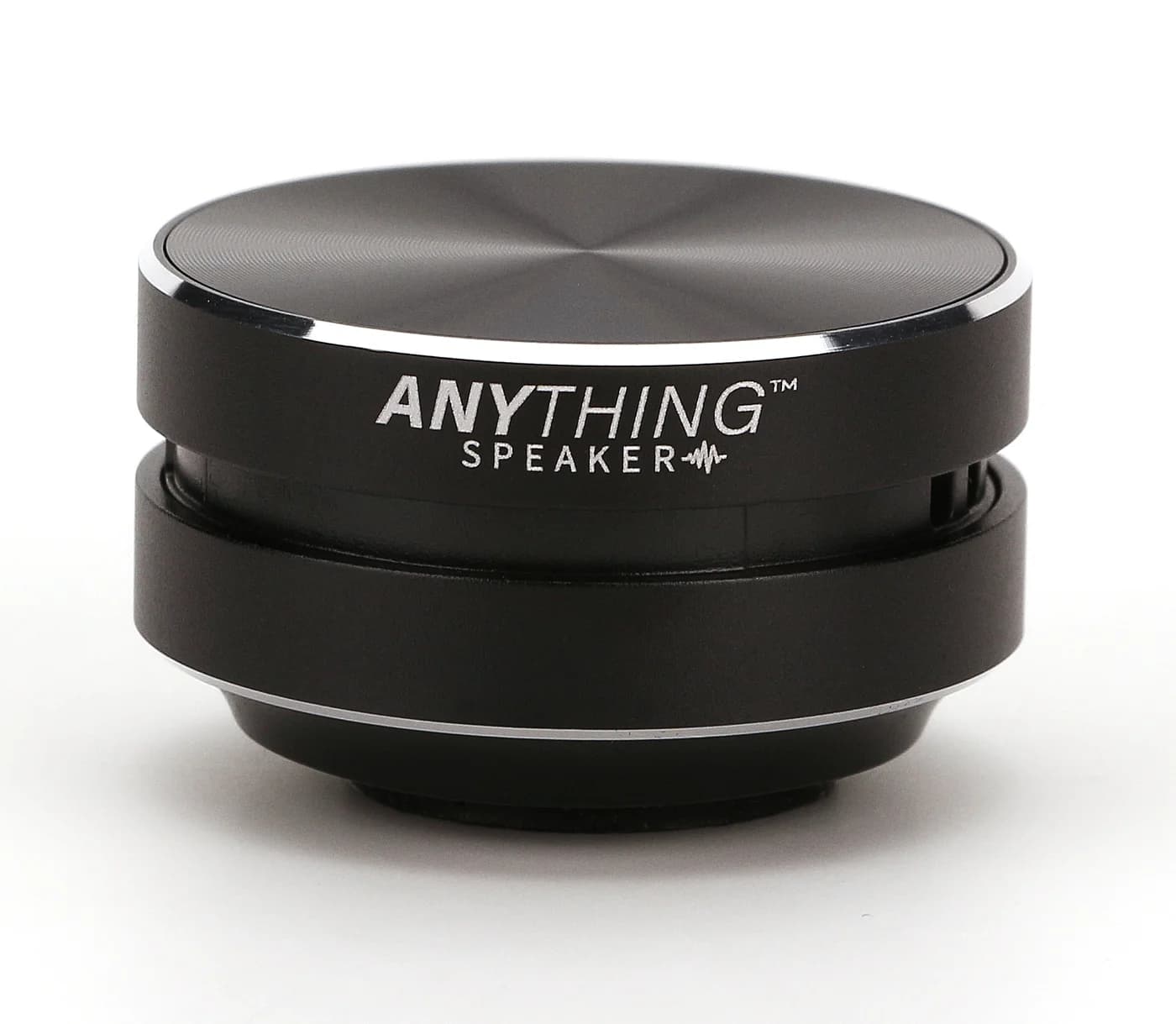 Anything Speaker bone conduction speaker, black puck-shaped unit